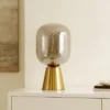 Safavieh Rain 18-Inch Table Lamp in Smoke Grey Glass and Brass 1 Safavieh Rain 18-Inch Table Lamp in Smoke Grey Glass and Brass -Safavieh Furniture GUEST 398e059b 9f3b 49d9 8207 5bbce1ce9b98