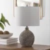 Safavieh Breeda Ceramic Table Lamp in Ivory with White Drum Shade 2 Safavieh Breeda Ceramic Table Lamp in Ivory with White Drum Shade -Safavieh Furniture GUEST b46cf0ea 1a67 40bb 825b ea59b753f61a