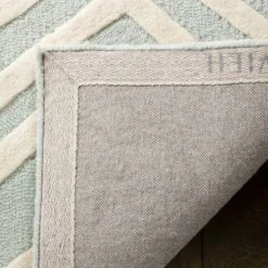 Safavieh Kids SFK910 Hand-Tufted Wool Area Rug -Safavieh Furniture GUEST f320feed 6e60 4952 96ce bfe3189f733d